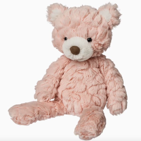 Pink plush teddy bear with a white snout and brown nose