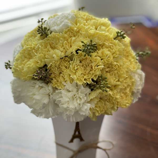 Yellow and white carnation bouquet in a white box with ribbon