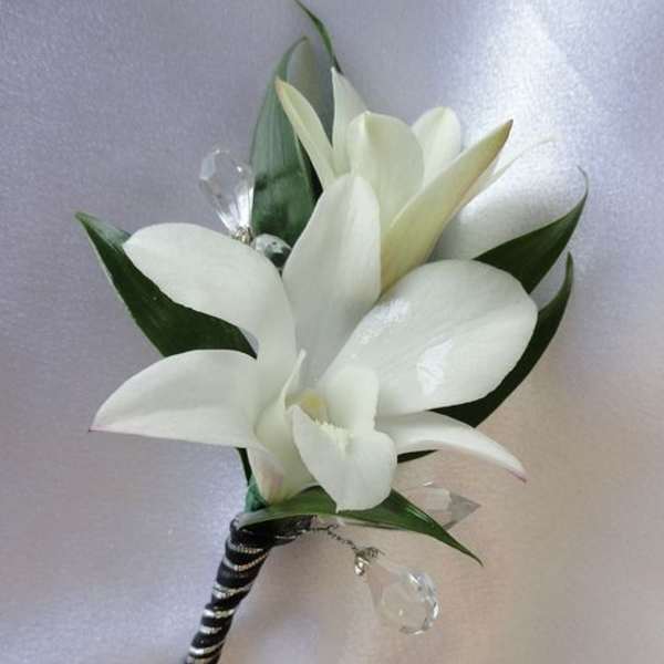 White calla lily boutonniere with black-and-silver wrapped stem