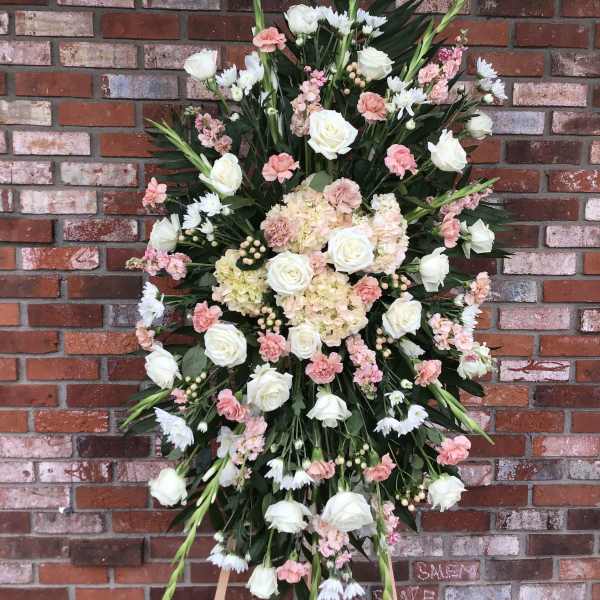Large standing floral spray with white roses and pink blooms