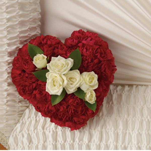 Heart-shaped red floral arrangement with white roses