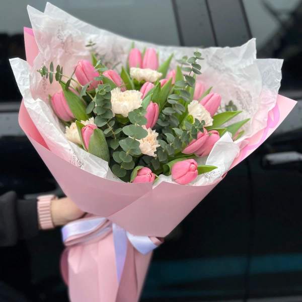 Pink tulip bouquet with white carnations wrapped in pink paper