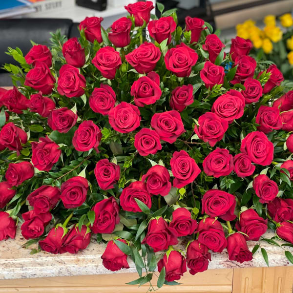 Large bouquet of red roses arranged on a countertop