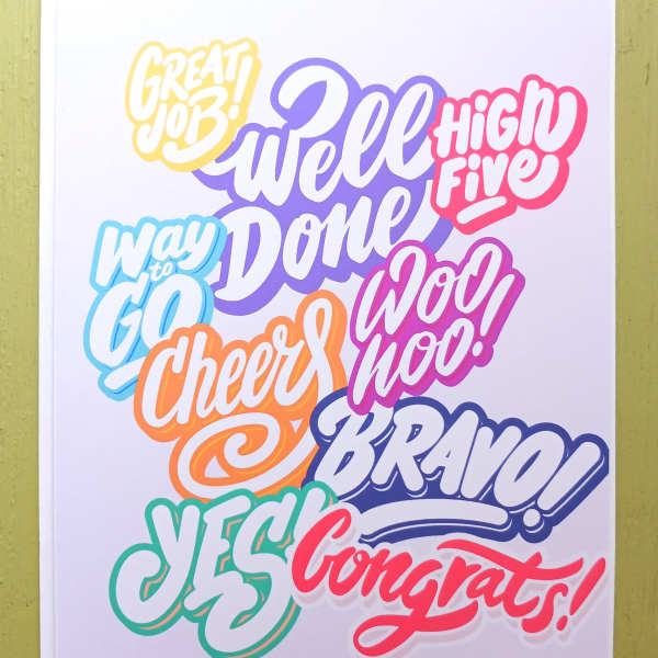 Colorful congratulations greeting card with bold hand-lettered phrases on a white background