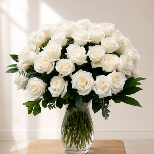 Bouquet of white roses in a clear glass vase