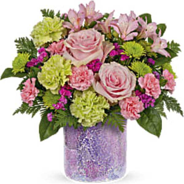 Pink roses and carnations in a purple vase