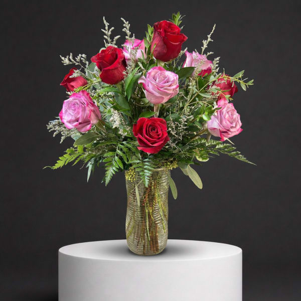 Bouquet of red and pink roses in a glass vase
