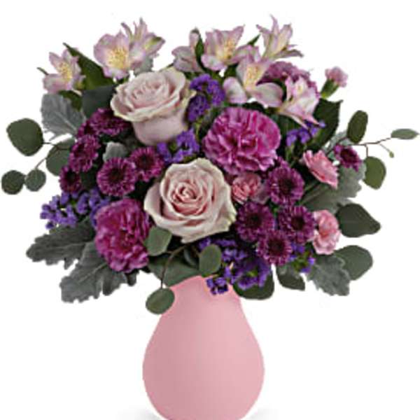 Pink and purple mixed bouquet in a pink vase