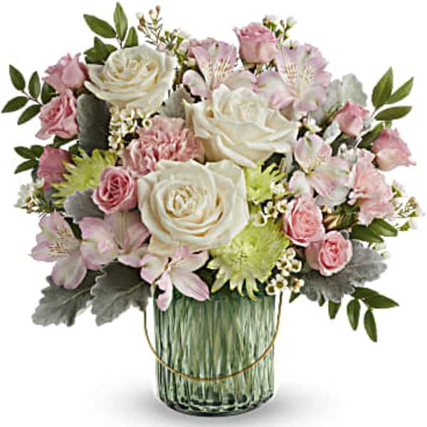 Pink and white flower arrangement in a glass vase