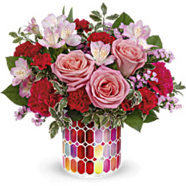Pink roses and red carnations in a colorful mosaic vase