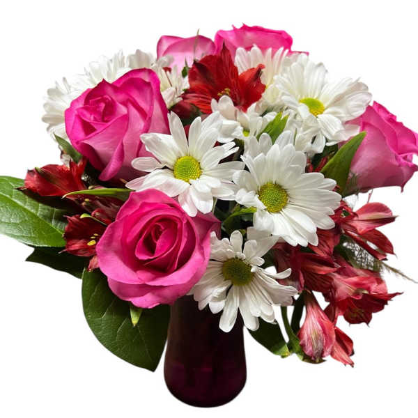 Pink roses and white daisies in a dark glass vase