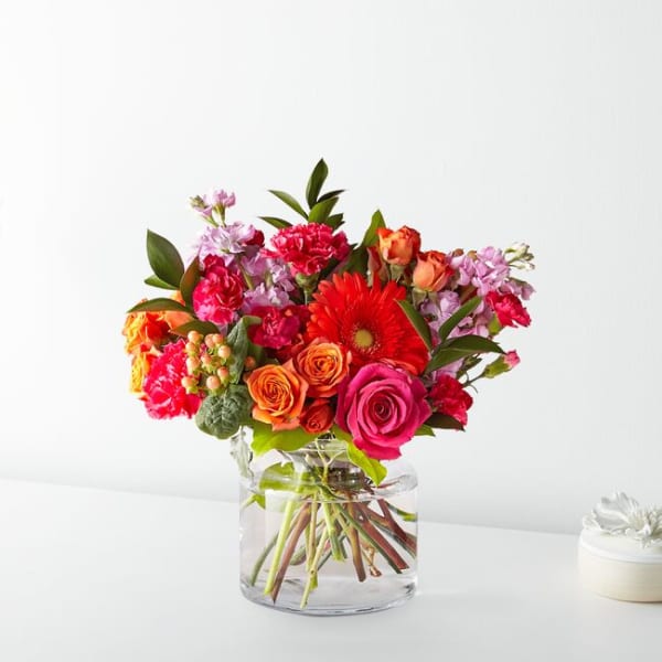 Bright mixed bouquet in a clear glass vase