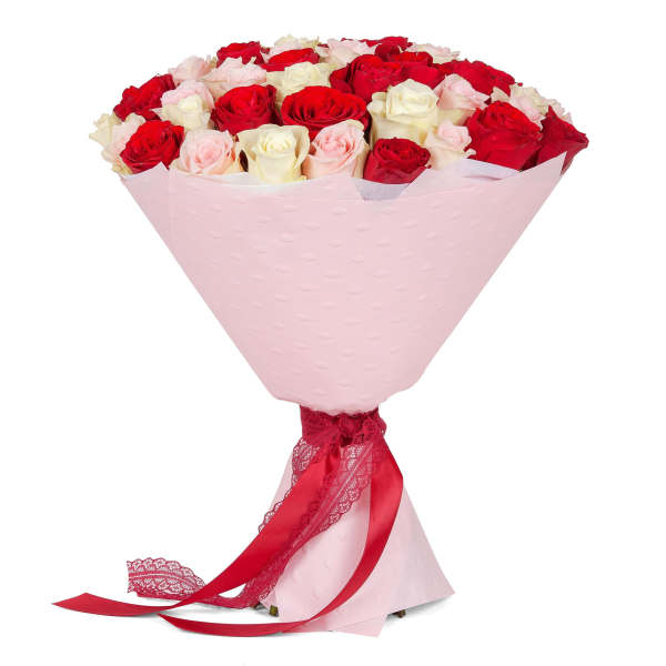 Bouquet of red, pink, and white roses wrapped in pale pink paper with a red ribbon.