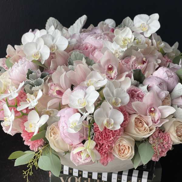 Large pastel bouquet of pink and white flowers in a box