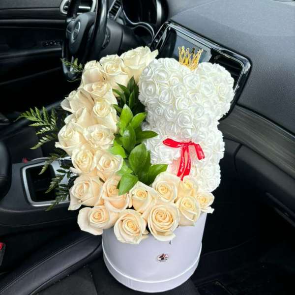 White rose teddy bear in a white hatbox with a red ribbon