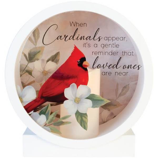 Cardinal memorial candle with flowers and a printed sympathy message