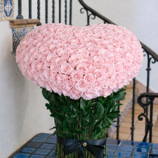 Large pink rose arrangement with a black ribbon tie