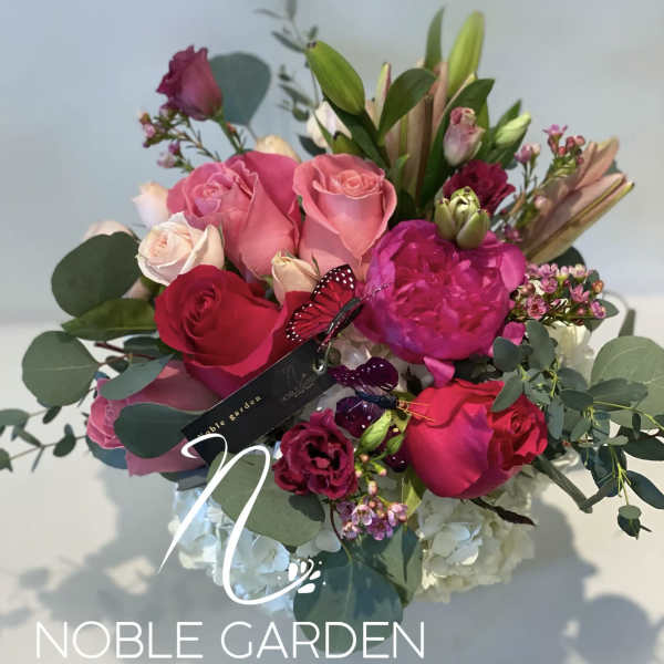 Bouquet of pink and red roses with eucalyptus and lilies