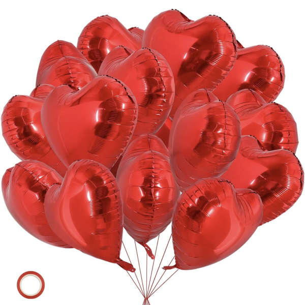 Cluster of red heart-shaped balloons with strings attached