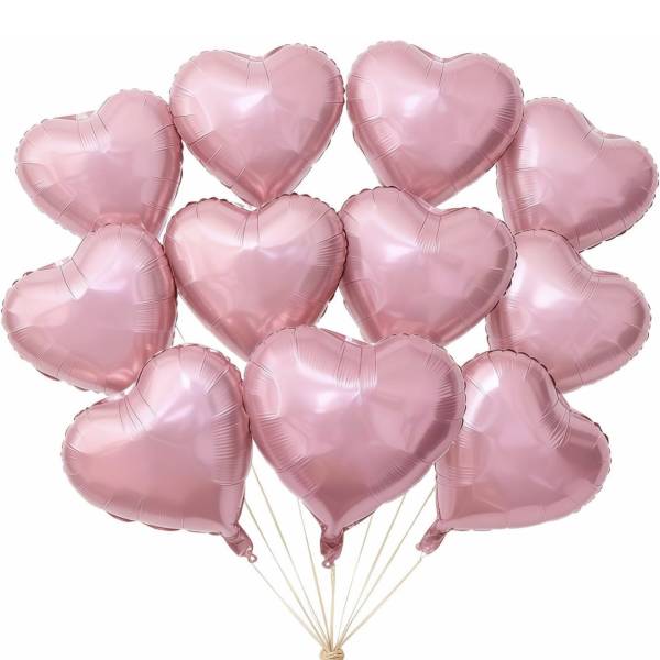 Cluster of pink heart-shaped balloons tied together with string