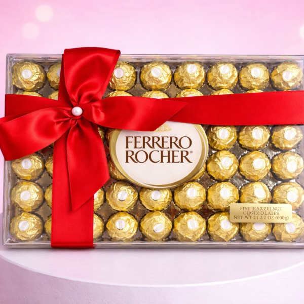 Box of Ferrero Rocher chocolates tied with a red ribbon