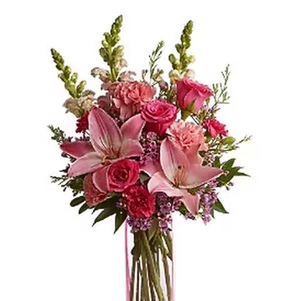 Pink lilies and roses in a clear rectangular vase