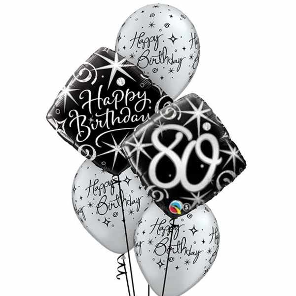 Cluster of black and white birthday balloons with star patterns
