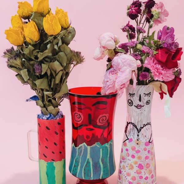 Painted pairs "Mamasita with macho melon man" vases w/a gift bouquet inside