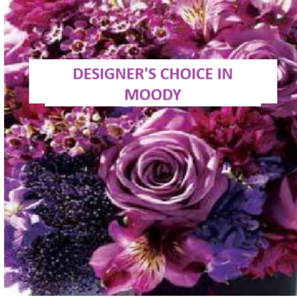 Purple floral arrangement with a large rose and mixed blossoms