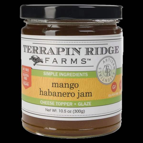 Jar of mango habanero jam with a black lid