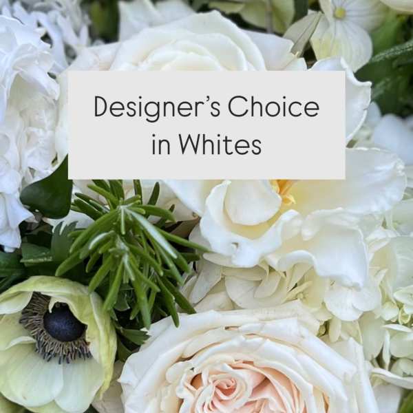White floral arrangement with roses and mixed blooms