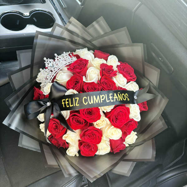 Bouquet of red and white roses with a black ribbon and tiara