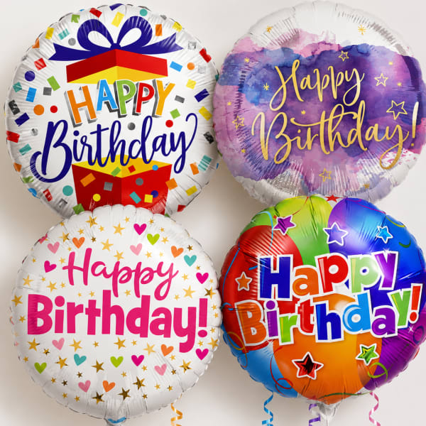Four round birthday balloons with colorful "Happy Birthday" designs