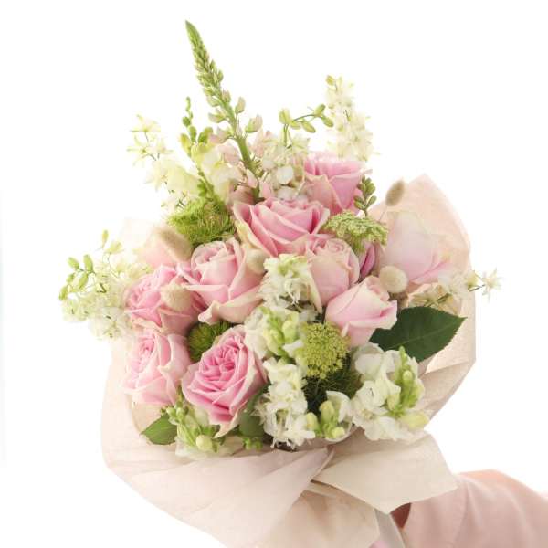 Pink rose bouquet with white flowers and ribbon wrap