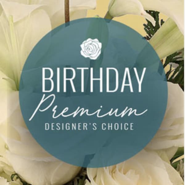 White flowers with a birthday premium label over the center