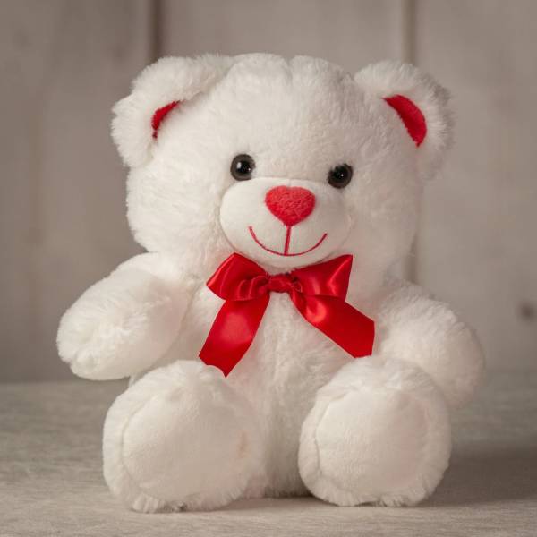 White teddy bear with a red bow and red nose