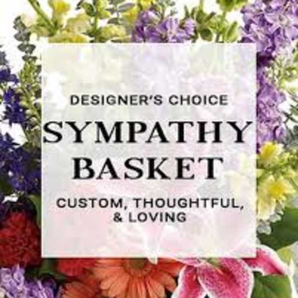 Sympathy basket sign surrounded by colorful flowers