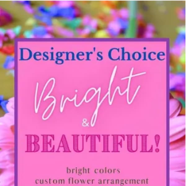 Pink flower arrangement with a designer's choice sign