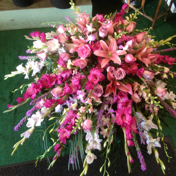 Large pink and white floral spray with lilies and roses