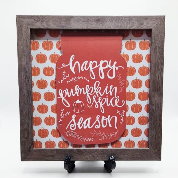 Framed fall sign reading "happy pumpkin spice season" with pumpkin pattern