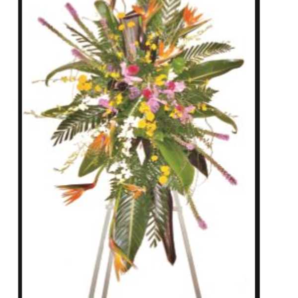 Tall tropical floral standing spray with orange and pink blooms