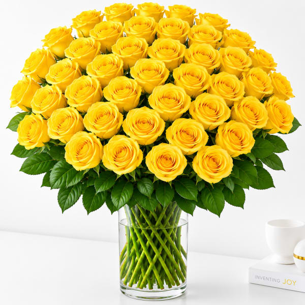 Bouquet of yellow roses in a clear glass vase