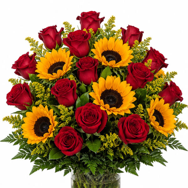 Bouquet of red roses and yellow sunflowers in a glass vase