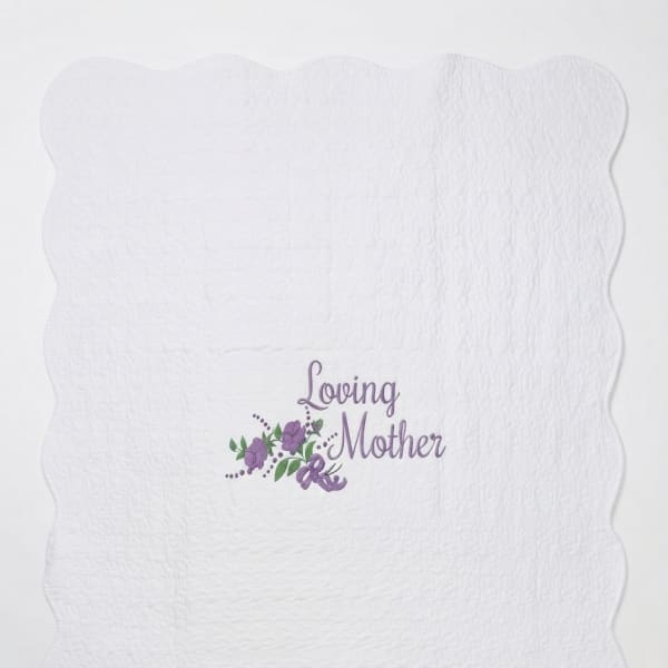 White quilted blanket with a purple "Loving Mother" floral design