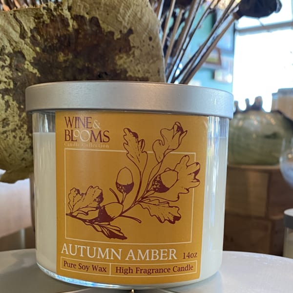 Autumn Amber soy wax candle in a glass jar with a silver lid