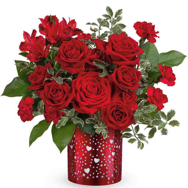 Red roses and carnations in a heart-patterned red vase