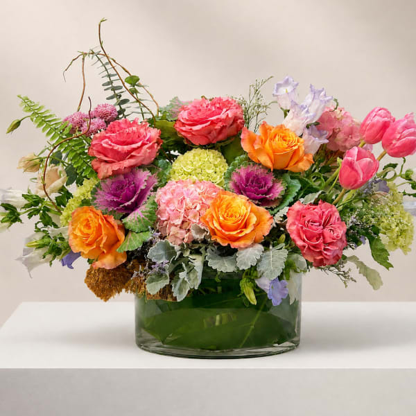 Colorful mixed flower arrangement in a glass vase