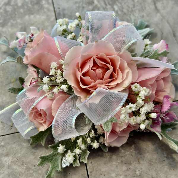 Pink rose bouquet with white filler flowers and sheer ribbon