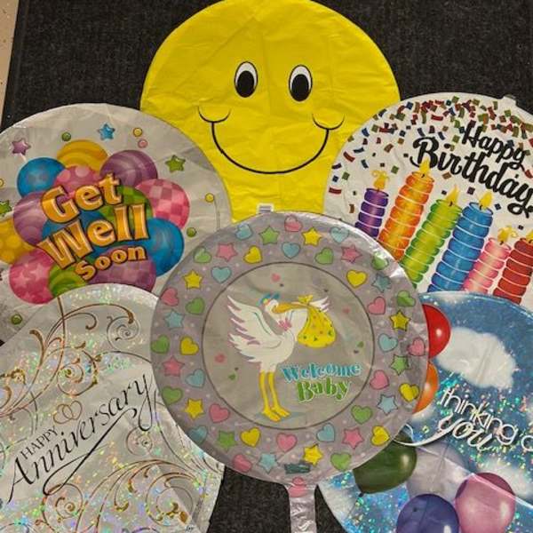 Assorted round foil balloons with birthday and baby messages