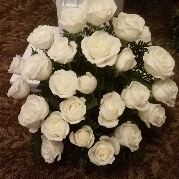 White rose bouquet arranged in a low cluster.